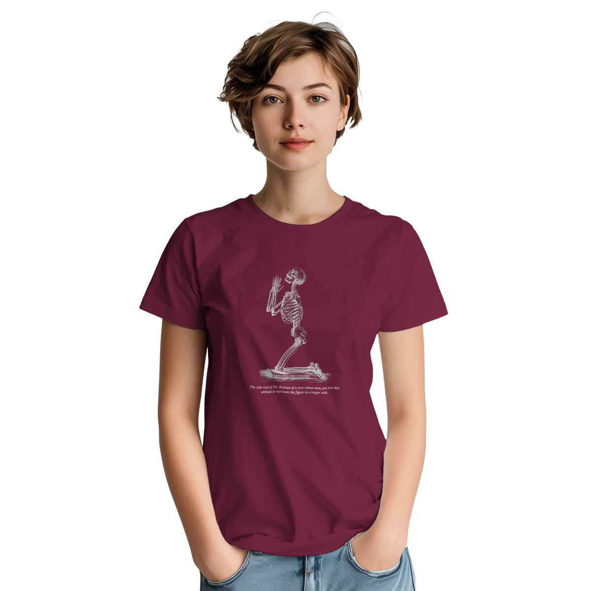 Kneeling Male Skeleton Anatomy T-shirt - Cheselden. Burgundy t-shirt featuring a white line drawing of a male skeleton kneeling in prayer.