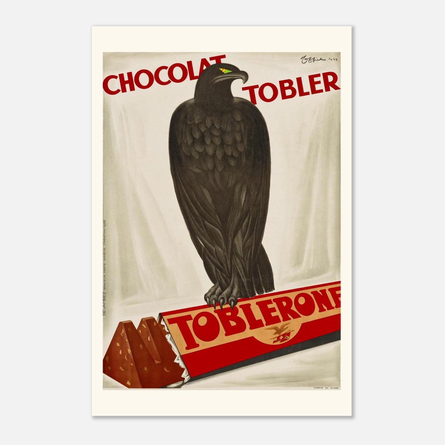 Affiche vintage "Chocolat Tobler Toblerone" par Leonetto Cappiello (1932) (60x90 cm / 24x36″). Affiche vintage pour le chocolat Toblerone par Leonetto Cappiello (1932), représentant un aigle noir devant une barre de chocolat Toblerone.