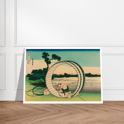 Estampe Le Fuji vu de la province d’Owari - Katsushika Hokusai. Reproduction ukiyo-e représentant un homme travaillant sur une roue à aubes près d'un moulin, avec le Mont Fuji visible au loin. Image d'illustration 9
