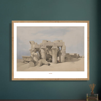 Gravure ancienne : Le temple de Kom Ombo, Égypte, David Roberts. Lithographie montrant les ruines d'un temple antique de Kom Ombo, partiellement enfoui dans le sable, avec des colonnes imposantes et des blocs de pierre éparpillés. Image d'illustration 7