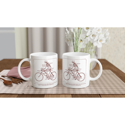 Mug blanc illustré d'une planche anatomique vintage de squelette à bicyclette. Mug blanc orné d'une illustration scientifique ancienne de couleur rouge bordeaux montrant un squelette humain pédalant sur un vélo, avec les noms des os du corps humain annotés en français.