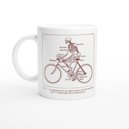 Mug blanc illustré d'une planche anatomique vintage de squelette à bicyclette. Mug blanc orné d'une illustration scientifique ancienne de couleur rouge bordeaux montrant un squelette humain pédalant sur un vélo, avec les noms des os du corps humain annotés en français.