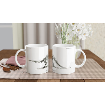 Mug en céramique avec illustration de squelette de Brontosaure. Mug blanc en céramique illustré d'une gravure scientifique représentant le squelette d'un Brontosaure avec la mention U.S. Geological Survey.
